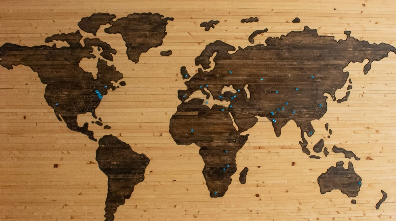 Global world map layout with international languages and navigation typography